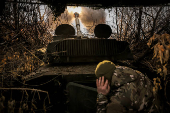 A Ukrainian serviceman fires a self-propelled howitzer towards Russian troops at a frontline near the town of Chasiv Yar