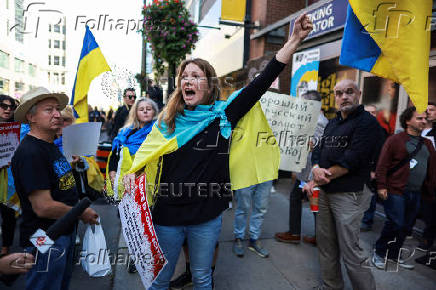 Protesters gather outside the Toronto International Film Festival (TIFF) screening of 'Russians at War', in Toronto