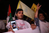 People protest following an Israeli strike on Lebanon, in Tehran