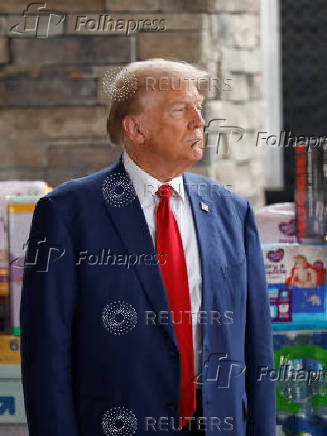 Republican presidential nominee Donald Trump and Georgia Governor Brian Kemp speak to the press about the impact of Hurricane Helene, in Evans