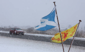 A car drives through the Drumochter pass on the A9, Scotland