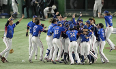 Taiwan team members celebrate winning the WBSC Premier12 baseball tournament at the final game against Japan, in Tokyo