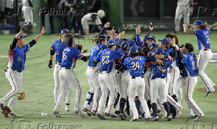 Taiwan team members celebrate winning the WBSC Premier12 baseball tournament at the final game against Japan, in Tokyo