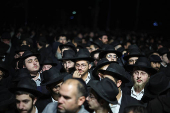 Mourners attend the funeral of Israeli rabbi, Zvi Kogan, in Kfar Habad