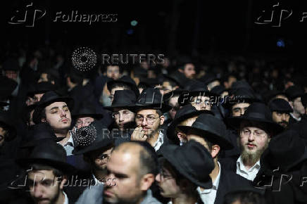 Mourners attend the funeral of Israeli rabbi, Zvi Kogan, in Kfar Habad