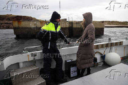 People vote in Ireland's general election, on the island of Gola