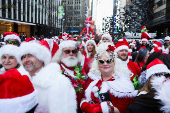 Revellers take part in SantaCon in New York City