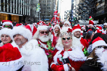 Revellers take part in SantaCon in New York City