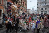 People dressed in traditional Ukrainian costumes attend a Christmas celebration in Lviv