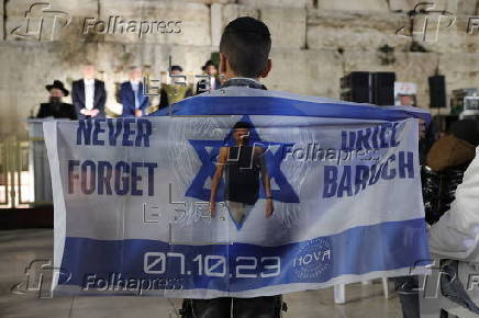 Hostages' families participate in lighting of first Hanukkah candle at Western Wall in Jerusalem