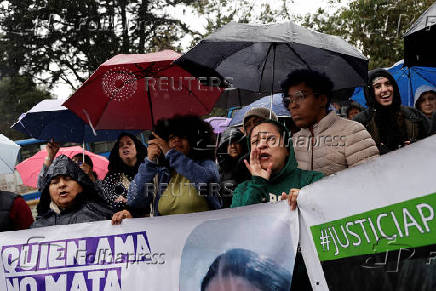 People gather to protest against the forced disappearance of four minors, in Quito