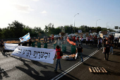 People attend a protest demanding the immediate release of hostages, near Ben Shemen