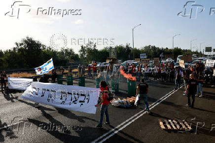 People attend a protest demanding the immediate release of hostages, near Ben Shemen
