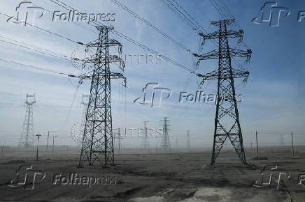 General view of electricity pylons during an organised media tour in Jiuquan