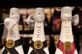 Moet Champagne is displayed on a shelf in a supermarket