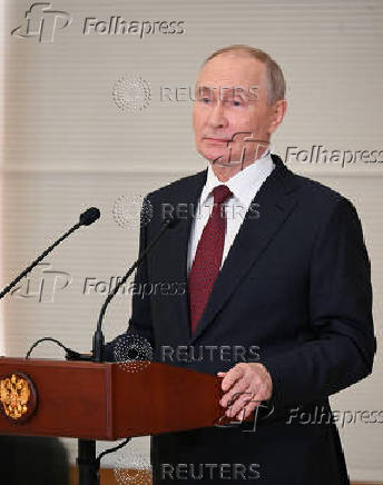 Russian President Putin attends a press conference in Astana