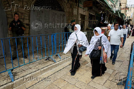 Palestinians hold Friday prayers during Ramadan at Jerusalem's Al-Aqsa compound