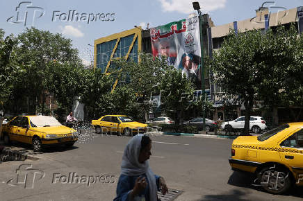 A banner of presidential candidate Mohammad Bagher Ghalibaf ?is displayed on a street in Tehran