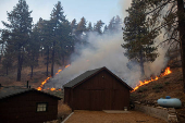 The Bridge Fire burns the mountain communities to the northeast of Los Angeles, in Wrightwood