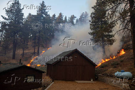 The Bridge Fire burns the mountain communities to the northeast of Los Angeles, in Wrightwood