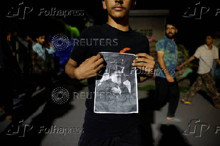 Kashmiri Shia Muslims shout slogans during a protest against Israel following the killing of Hezbollah leader Nasrallah in an Israeli airstrike in Beirut, in Srinagar