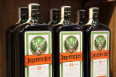 Bottles of Jagermeister are displayed on a shelf in a supermarket