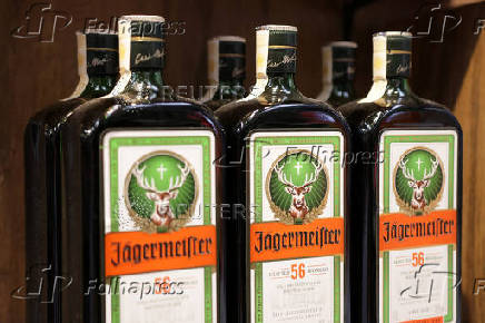 Bottles of Jagermeister are displayed on a shelf in a supermarket