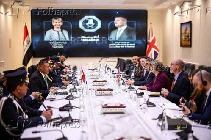 Britain's Home Secretary Yvette Cooper meets Iraq's Minister of Interior Abdul Amir Al-Shammari, in Baghdad