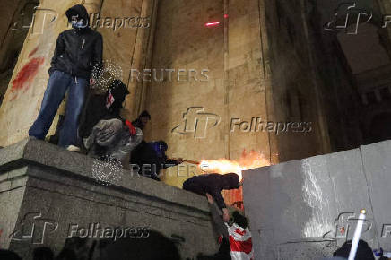 Georgian opposition supporters protest against government's EU application delay, in Tbilisi