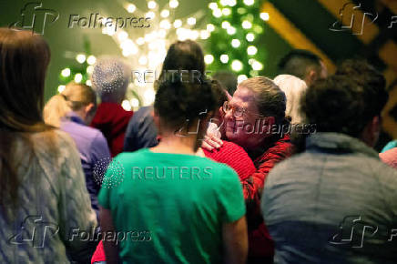 Worshipers at Blackhawk Church gather to pray for victims and survivors of a shooting in Madison