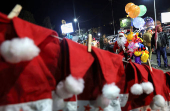 Syrian street vendor dressed as Santa Claus in Damascus