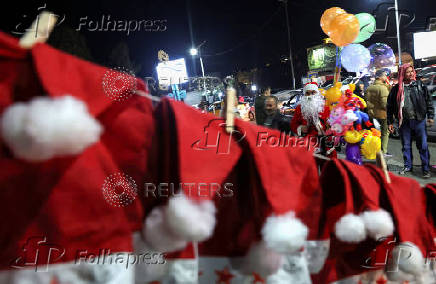 Syrian street vendor dressed as Santa Claus in Damascus