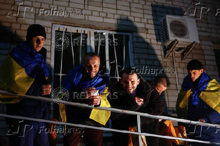 Ukrainian prisoners of war (POWs) return after a swap, in an undisclosed location