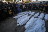 Palestinians mourn their dead at Deir Al Balah hospital after Israeli airstrike in central Gaza