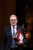 British Prime Minister Keir Starmer walks outside 10 Downing Street in London