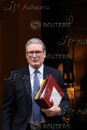 British Prime Minister Keir Starmer walks outside 10 Downing Street in London