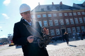 Danish Chamber of Commerce CEO Mikkelsen receives top of spire of Stock Exchange building