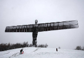 Snowfall at Antony Gormley's Angel of the North, in Gateshead