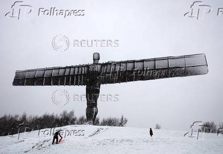 Snowfall at Antony Gormley's Angel of the North, in Gateshead