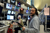 Traders work on the floor of the NYSE in New York