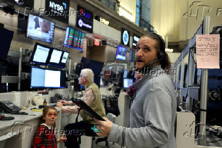 Traders work on the floor of the NYSE in New York