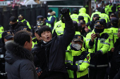 Pro-Yoon protesters participate in a rally outside a court, in Seoul