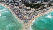 A drone view shows people enjoying the Macumba beach, during a heatwave in Rio de Janeiro