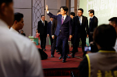 Taiwan President-elect Lai Ching-te speaks waves during a press conference in Taipei