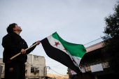 People celebrate after Syrian rebels announced that they had ousted President Bashar al-Assad, in Majdal Shams