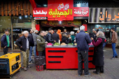 People at a shop in Aleppo