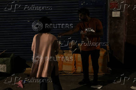 Anjos da Noite (Night Angels) NGO distributes food to homeless people on Christmas Eve in Sao Paulo