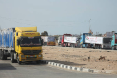 Aid trucks stand near the Rafah border crossing between Egypt and the Gaza Strip