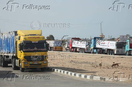 Aid trucks stand near the Rafah border crossing between Egypt and the Gaza Strip