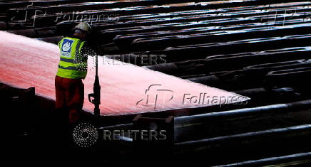 FILE PHOTO: FILE PHOTO: Steel is seen in the rolling mill following the  recommissioning of the works by Liberty Steel Group at the Dalzell steel plant in Motherwell